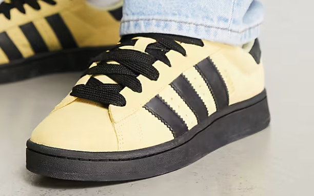 adidas Originals Campus 00s sneakers in yellow and black Now $66.00. Was $110.00. (-40%)Now $66.00 Was $110.00(-40%)